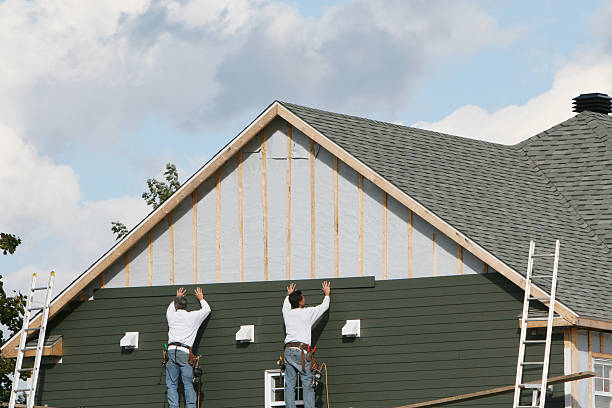 Professional Storm Damage Siding Repair technician working in Avon, MN